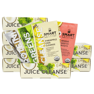 Single serving packs of Vegan Vanilla Proteini, Organic Pressed Greens, Pineapple Chia Cleanse, and Revive Beet+Roots in front of stacked boxes of Juice Cleanse against a white background.